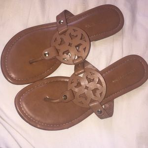 Brown sandals that have been worn a few times